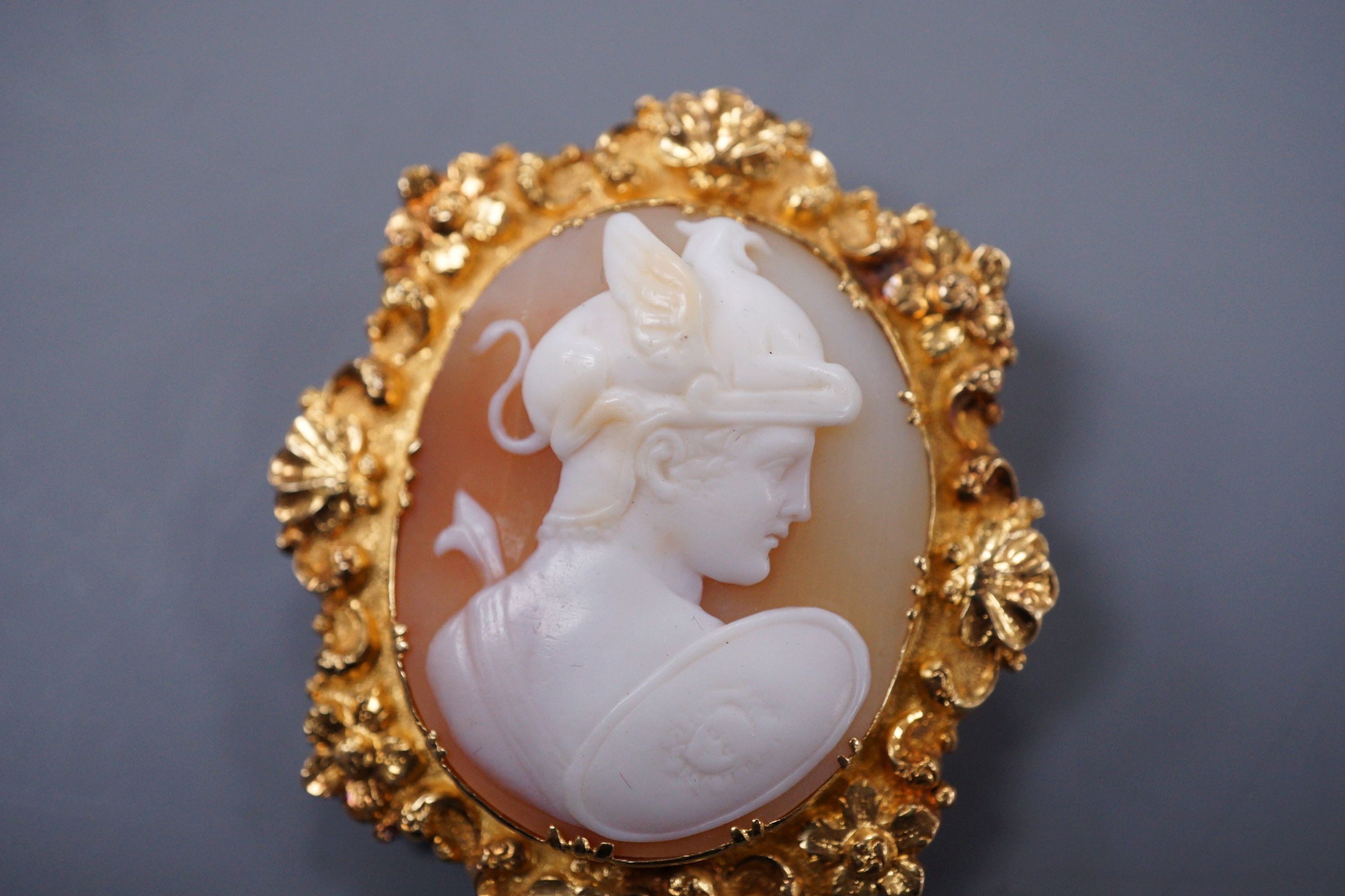 A Victorian yellow metal mounted cameo brooch carved with a bust of Hermes, 4.5cm